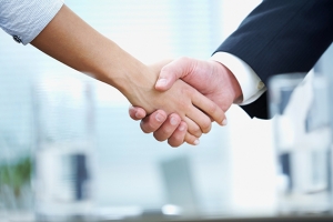 Clouse-up of businessman and businesswoman shaking hands
